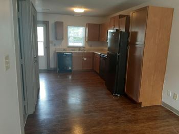 Kitchen with black fridge